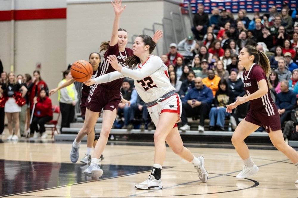 University of Carleton Ravens' Jacqueline Urban makes a pass against the University of Ottawa Gee-Gees during U Sports women's basketball action in Ottawa in this March 8, 2025 handout photo. THE CANADIAN PRESS/HO, Charles Fortin *MANDATORY CREDIT*
