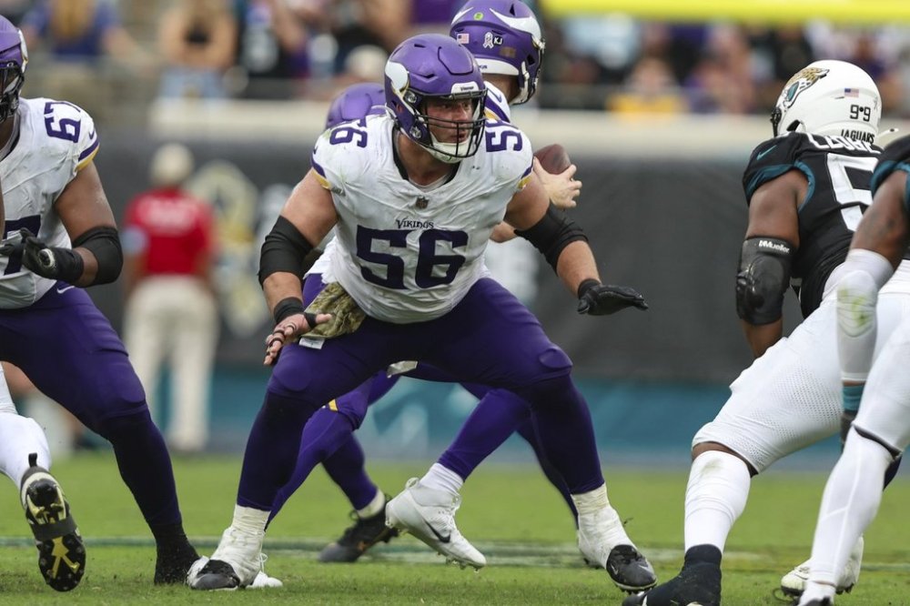 FILE - Minnesota Vikings center Garrett Bradbury (56) rises up to block during an NFL football game against the Jacksonville Jaguars, Nov. 10, 2024, in Jacksonville, Fla. (AP Photo/Gary McCullough, File)