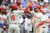 Philadelphia Phillies' Kyle Schwarber, right, celebrates his three-run home run with Brandon Marsh (16) during the sixth inning of a baseball game against the Washington Nationals, Saturday, March 29, 2025, in Washington. (AP Photo/Nick Wass)