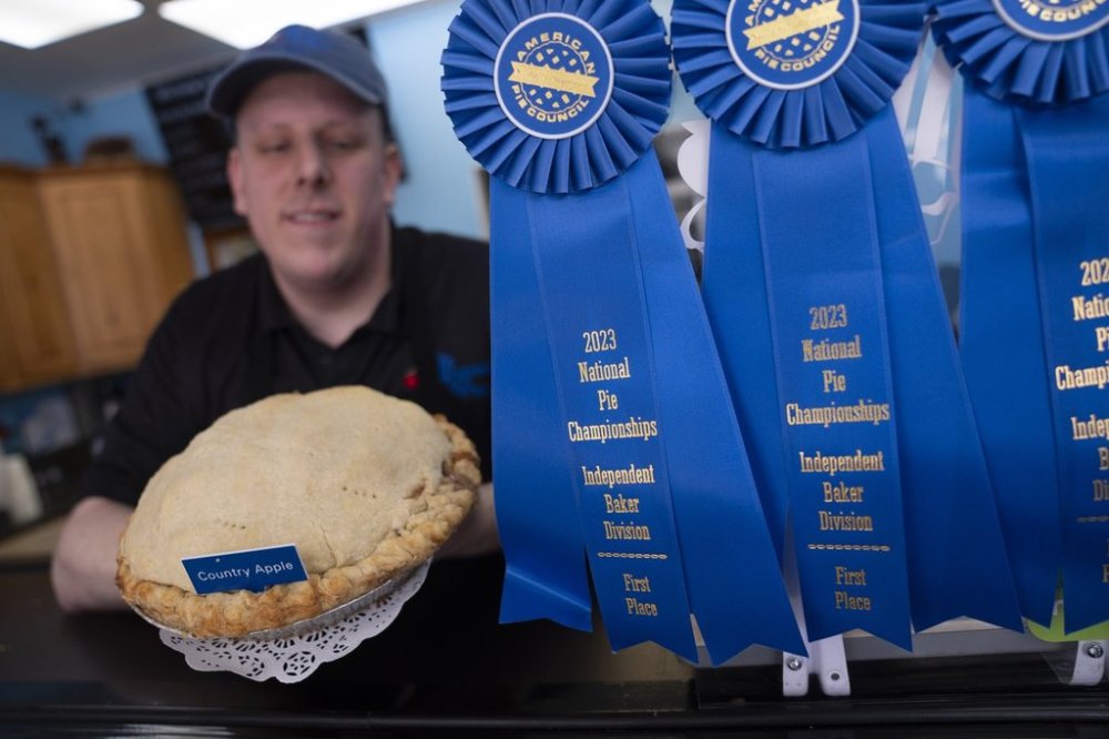 FILE - Manager Stephen Jarrett displays their National Pie Championships 1st place winning country apple pie at Michele's Pies, Wednesday, March 13, 2024, in Norwalk, Conn. (AP Photo/John Minchillo, File)