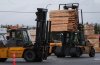 Heavy equipment is used to move lumber at the Western Forest Products Duke Point Sawmill in Nanaimo, B.C., on March 28, 2025. THE CANADIAN PRESS/Darryl Dyck