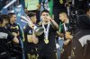 Mexico's Israel Reyes lifts the tournament trophy the team won against Panama in a CONCACAF Nations League final soccer match Sunday, March 23, 2025, in Inglewood, Calif. (AP Photo/Etienne Laurent)