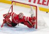 Canada goaltender Jordan Binnington (50) stretches to make a save against the United States during first period 4 Nations Face-Off hockey action in Montreal on Saturday, Feb. 15, 2025. THE CANADIAN PRESS/Christinne Muschi