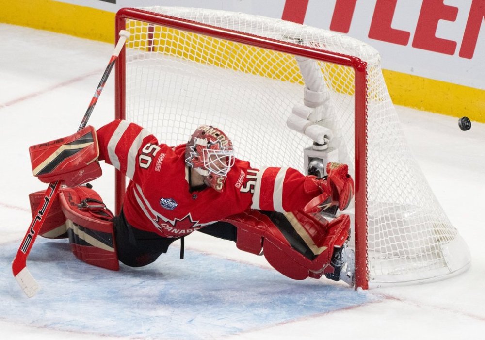 Canada goaltender Jordan Binnington (50) stretches to make a save against the United States during first period 4 Nations Face-Off hockey action in Montreal on Saturday, Feb. 15, 2025. THE CANADIAN PRESS/Christinne Muschi