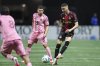 Atlanta United midfielder Miguel Almirón (10) looks to pass the ball against Inter Miami defender Jordi Alba (18) during the first half of an MLS soccer match, Sunday, March, 16, 2025, in Atlanta. (AP Photo/Colin Hubbard)