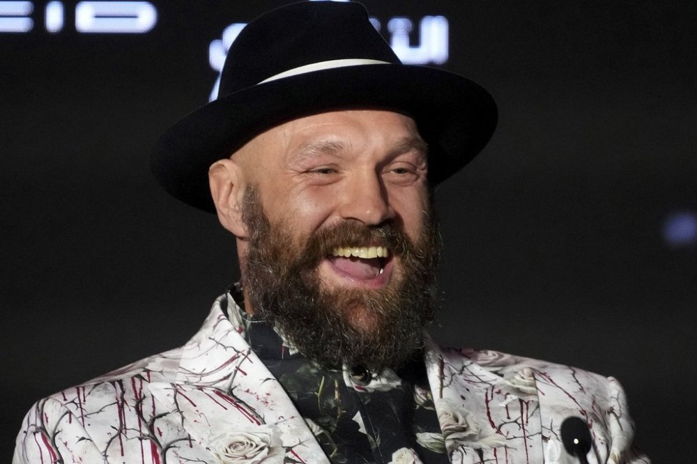 FILE - Boxer Tyson Fury speaks during a press conference in Riyadh, Saudi Arabia, Thursday, Dec. 19, 2024 ahead of the WBA, WBO, and WBC heavyweight title bout between Britain's Tyson Fury and Ukraine's Oleksandr Usyk. (AP Photo/Frank Augstein, File)
