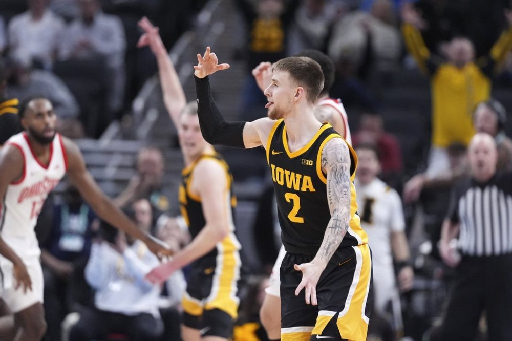 Iowa guard Brock Harding (2) reacts to a basket against Ohio State during the second half of an NCAA college basketball game in the first round of the Big Ten Conference tournament in Indianapolis, Wednesday, March 12, 2025. (AP Photo/Michael Conroy)