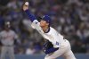 Los Angeles Dodgers pitcher Yoshinobu Yamamoto throws to the plate during the first inning of a baseball game against the Detroit Tigers, Friday, March 28, 2025, in Los Angeles. (AP Photo/Mark J. Terrill)
