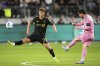 Inter Miami forward Lionel Messi, right, kicks past Los Angeles FC forward Nathan Ordaz during the first half of an MLS soccer match, Wednesday, April 2, 2025, in Los Angeles. (AP Photo/Mark J. Terrill)