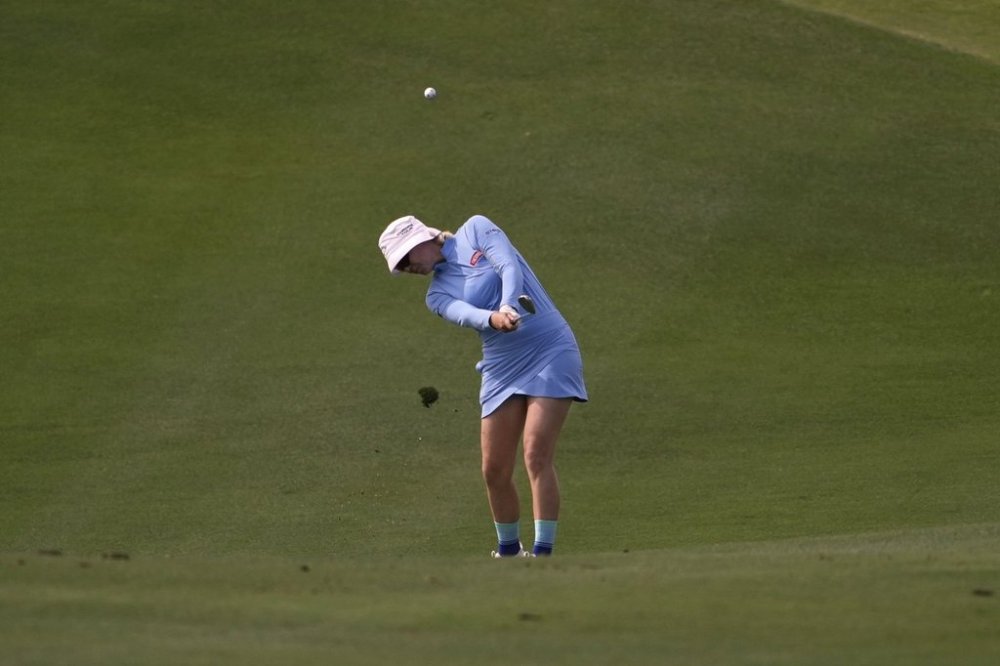 Madelene Sagstrom, of Sweden, hits from the 18th fairway during the first round of the Ford Championship LPGA golf event, Thursday, March 27, 2025, in Phoenix. (AP Photo/Matt York)