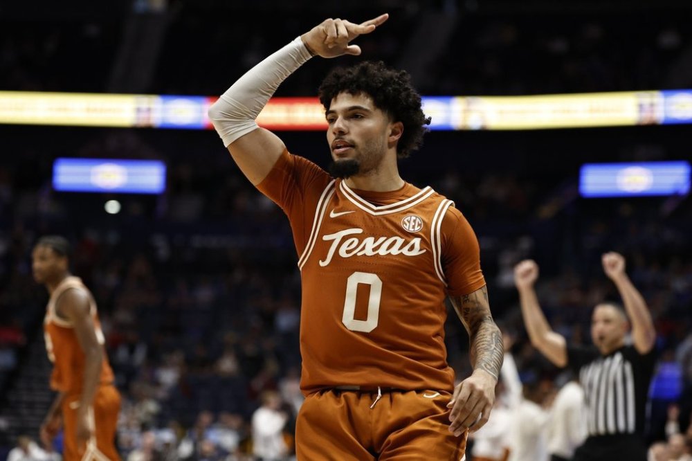 Texas guard Jordan Pope (0) celebrates his three-point shot against Texas A&M during the first half of an NCAA college basketball game in the second round of the Southeastern Conference tournament, Thursday, March 13, 2025, in Nashville, Tenn. (AP Photo/Wade Payne)