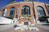 Cans and bottle of beer, along with other items, adorn the base of the the Bob Uecker statue in front of American Family Field following a baseball game between the Milwaukee Brewers and the Kansas City Royals on Opening Day, Monday, March 31, 2025, in Milwaukee. (AP Photo/Kayla Wolf)