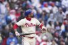 Philadelphia Phillies' Nick Castellanos watches after hitting a grand slam off Los Angeles Dodgers' Alex Vesia during the third inning of a baseball game, Sunday, April 6, 2025, in Philadelphia. (AP Photo/Derik Hamilton)