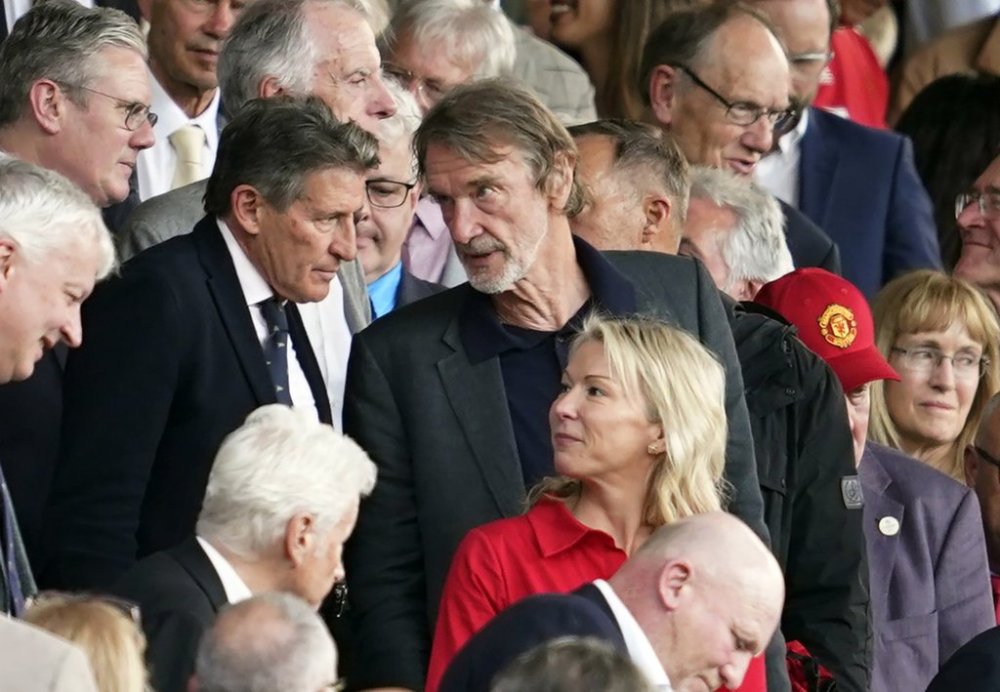 FILE - Jim Ratcliffe, center, in the stands during the English Premier League soccer match between Manchester United and Arsenal at the Old Trafford Stadium in Manchester, England, Sunday, May 12, 2024. (AP Photo/Dave Thompson, file)