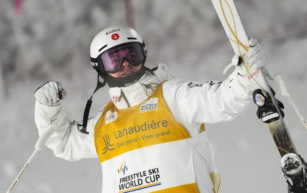 Canadian freestyle skiing star Mikael Kingsbury won silver in a World Cup moguls event Tuesday on the same course that will be used at next year's Milan-Cortina Olympics. Kingsbury celebrates after winning the men's World Cup freestyle skiing dual moguls in Saint-Come, Que., Saturday, Feb. 1, 2025. THE CANADIAN PRESS/Sean Kilpatrick