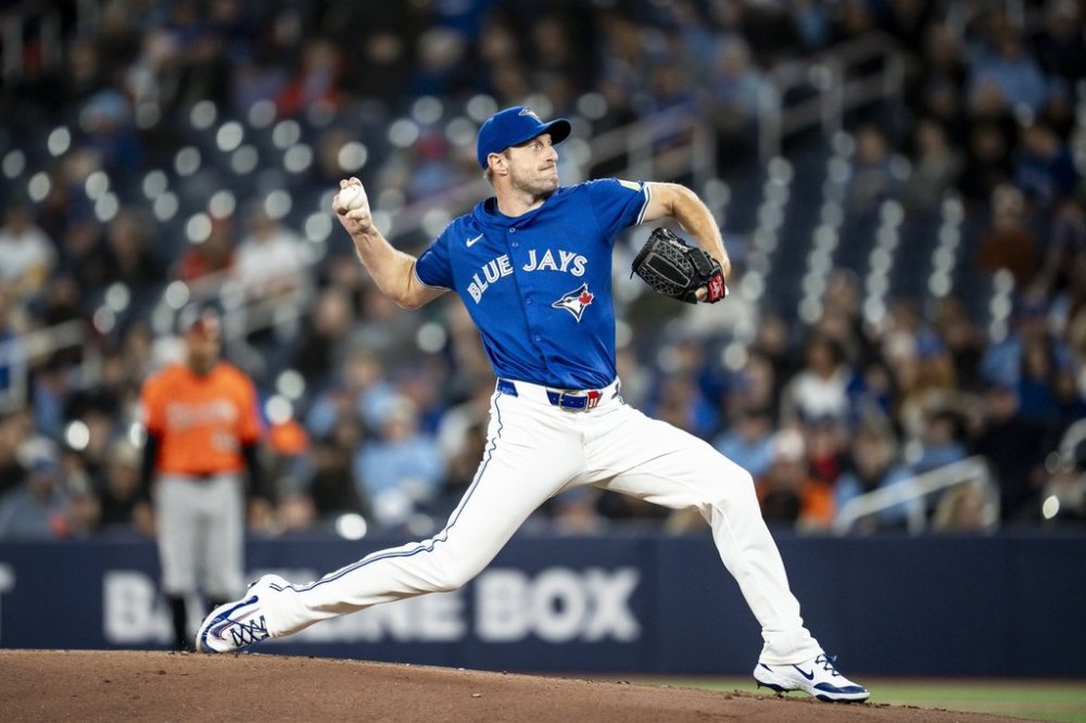 Toronto Blue Jays pitcher Max Scherzer (31) pitches the ball during first inning MLB baseball action against the Baltimore Orioles, in Toronto on Saturday, March 29, 2025. THE CANADIAN PRESS/Christopher Katsarov<