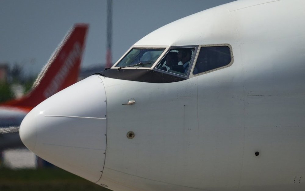 Pilots taxi a WestJet Boeing 737-700 aircraft to the runway for departure from Vancouver International Airport, in Richmond, B.C., on Friday, May 19, 2023. THE CANADIAN PRESS/Darryl Dyck