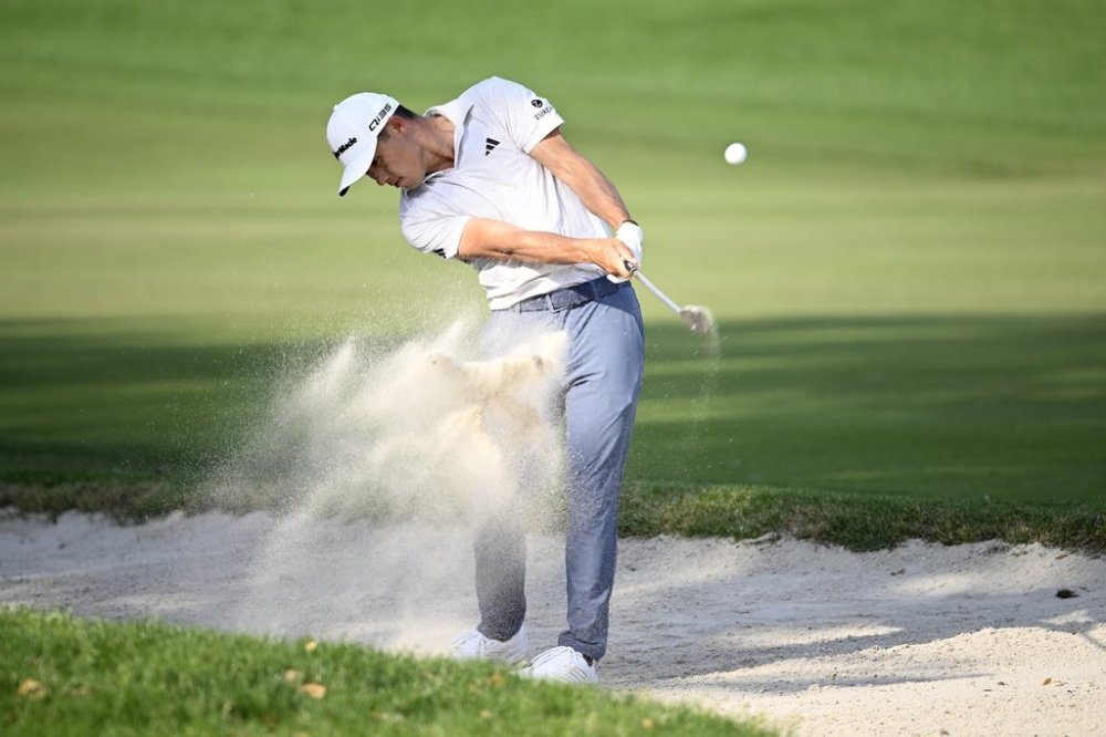 Collin Morikawa hits from a bunker alongside the 16th fairway during the final round of the Arnold Palmer Invitational at Bay Hill golf tournament, Sunday, March 9, 2025, in Orlando, Fla. (AP Photo/Phelan M. Ebenhack)