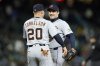 Detroit Tigers first baseman Spencer Torkelson (20) reaches to hug closing pitcher Tommy Kahnle after a win over the Seattle Mariners in a baseball game, Tuesday, April 1, 2025, in Seattle. (AP Photo/John Froschauer)
