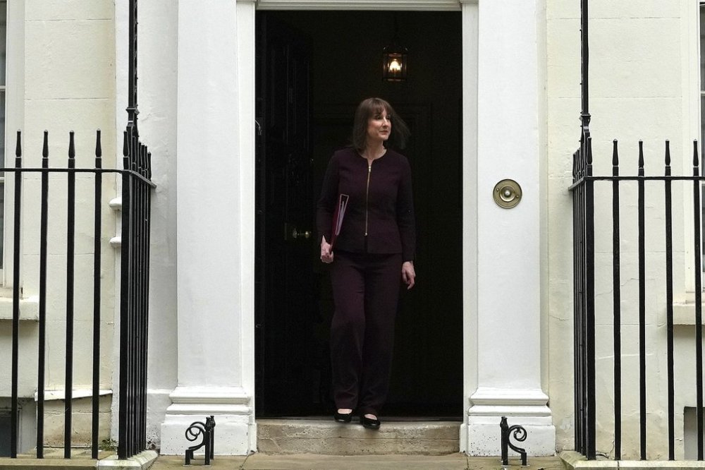 Britain's Chancellor of the Exchequer, Rachel Reeves, leaves 11 Downing Street to deliver the spring statement at the House of Commons in London, Wednesday, March 26, 2025. (AP Photo/Alastair Grant)