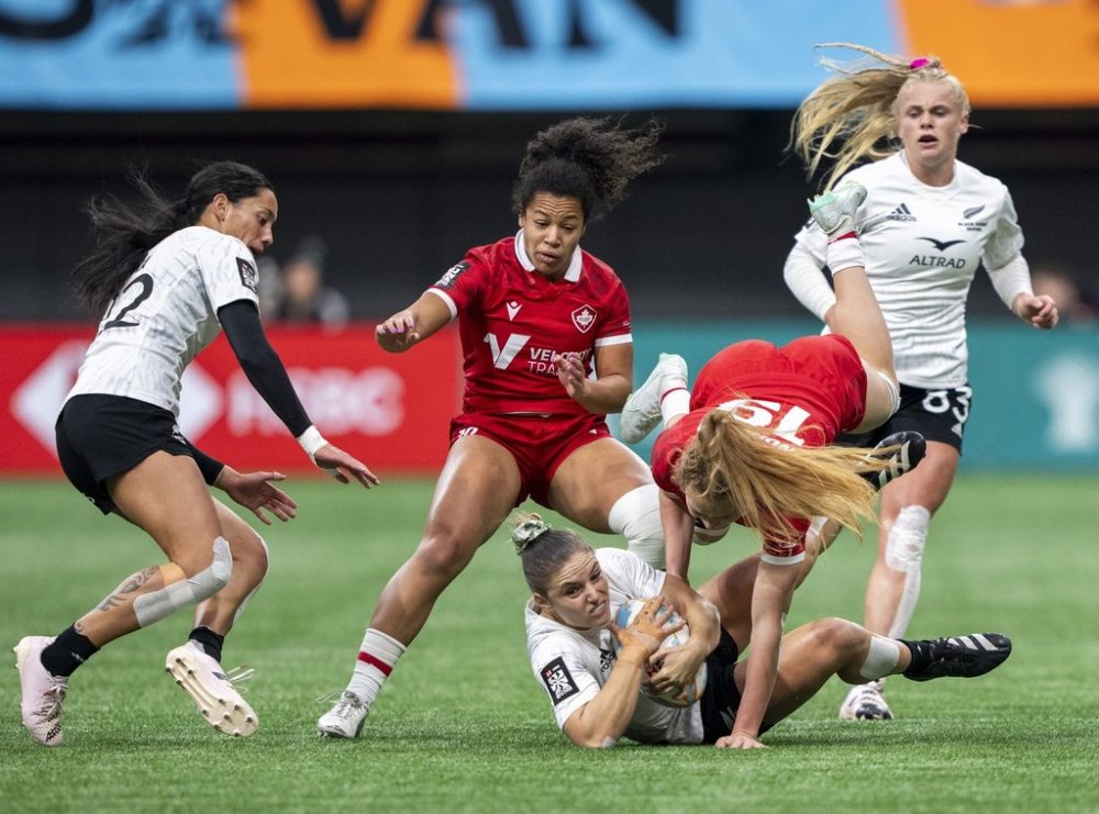 Canada's Carissa Norsten tackles New Zealand's Michaela Blyde as Canada's Fancy Bermudez, back centre, New Zealand's Shiray Kaka, left and New Zealand's Jorja Miller, right watch during Vancouver Sevens women rugby semifinal action, in Vancouver, on Sunday, Feb. 25, 2024. THE CANADIAN PRESS/Ethan Cairns