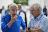FILE - IOC President Thomas Bach, left, talks with former IOC President Juan Antonio Samaranch while touring the Olympic Village ahead of the 2024 Summer Olympics, Monday, July 22, 2024, in Paris, France. (AP Photo/David Goldman, Pool, File)