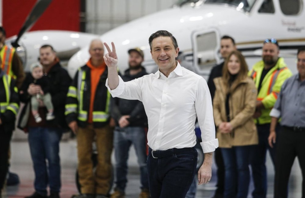 Conservative Leader Pierre Poilievre greets aircraft mechanics and supporters during a press conference at Fast Air in Winnipeg on Saturday, March 29, 2025. CANADIAN PRESS/John Woods