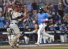 Miami Marlins' Derek Hill, right, scores on a double by teammate Nick Fortes during the second inning of a baseball game against the Pittsburgh Pirates, Sunday, March 30, 2025, in Miami. (AP Photo/Michael Laughlin)