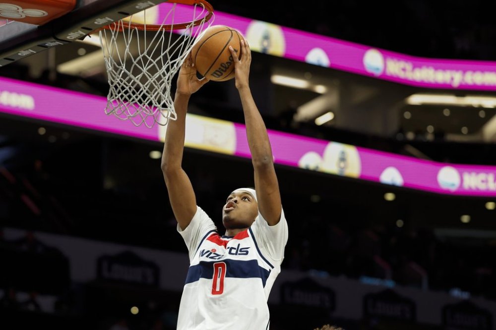 Washington Wizards guard Bilal Coulibaly goes up for a dunk against the Charlotte Hornets during the second half of an NBA basketball game in Charlotte, N.C., Saturday, March 1, 2025. (AP Photo/Nell Redmond)