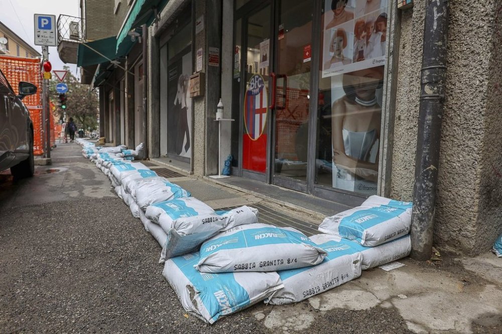 Sandbags are placed on a street in Bologna, Italy, Friday March 14, 2025, as heavy rain battered the northern Emilia-Romagna region, where local rivers were above alert levels. (Guido Calamosca/LaPresse via AP)