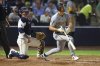 Pittsburgh Pirates' Bryan Reynolds, right, reacts in front of Tampa Bay Rays catcher Danny Jansen after flying out during the sixth inning of a baseball game Monday, March 31, 2025, in Tampa, Fla. (AP Photo/Mike Carlson)