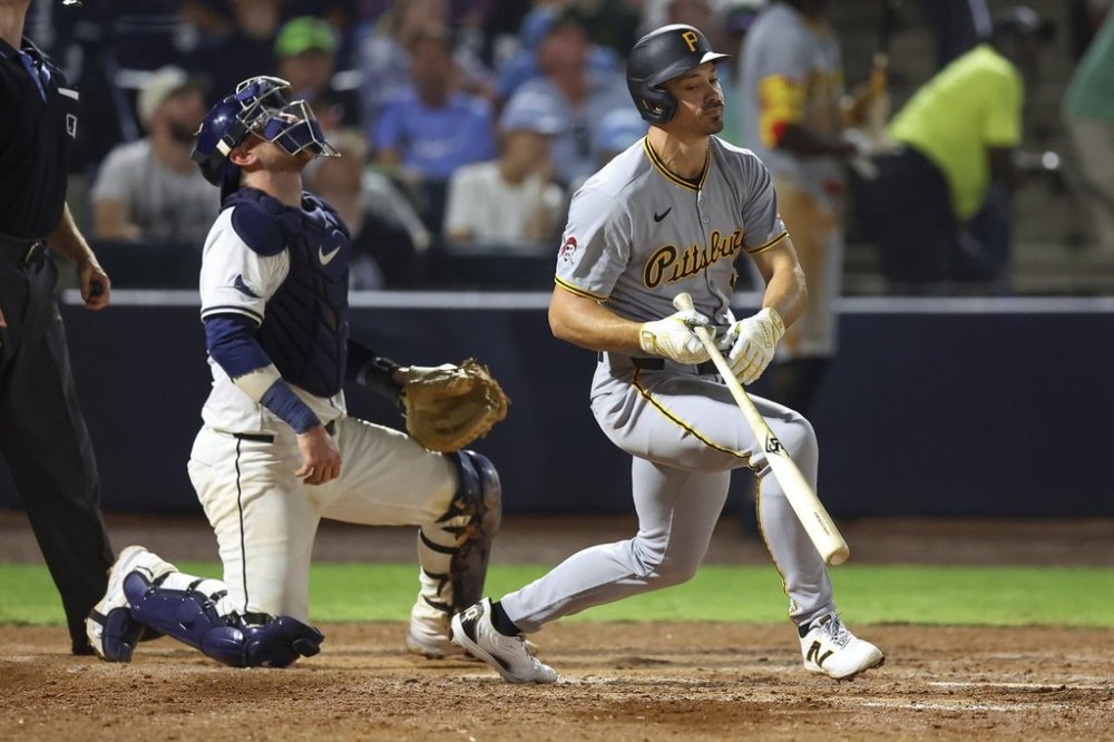 Pittsburgh Pirates' Bryan Reynolds, right, reacts in front of Tampa Bay Rays catcher Danny Jansen after flying out during the sixth inning of a baseball game Monday, March 31, 2025, in Tampa, Fla. (AP Photo/Mike Carlson)