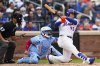 New York Mets' Juan Soto doubles on a line drive during the sixth inning of a baseball game against the Toronto Blue Jays, Friday, April 4, 2025, in New York. (AP Photo/Julia Demaree Nikhinson)