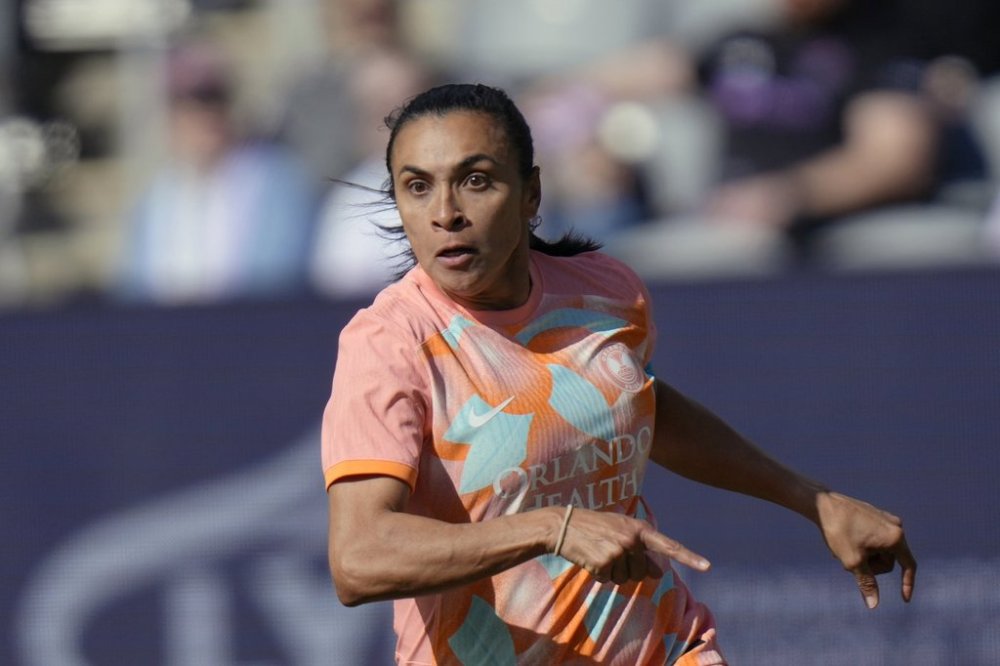 FILE - Orlando Pride's Marta (10) in action during an NWSL soccer match against Racing Louisville, Saturday, March 16, 2024, in Louisville, Ky. (AP Photo/AJ Mast, File)