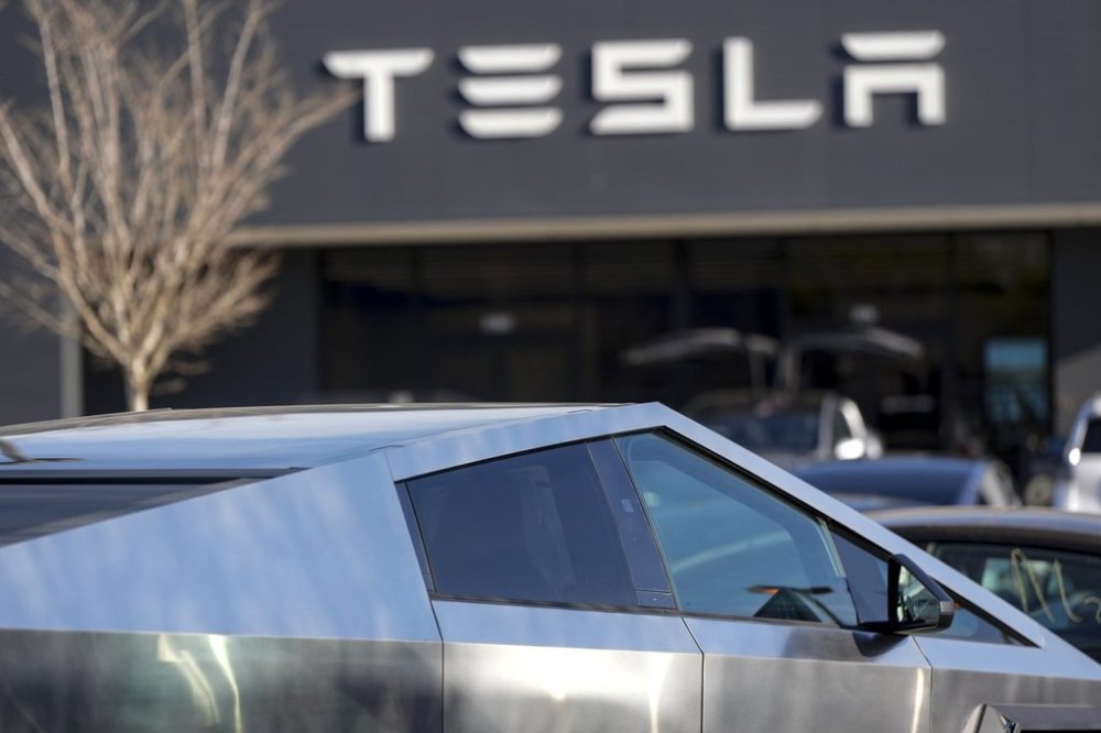 A Tesla Cybertruck and other Telsla vehicles sit at a dealership in Kennesaw, Ga., Wednesday, March 19, 2025. THE CANADIAN PRESS/AP-Mike Stewart