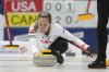 Canada skip Rachel Homan releases a stone during a game against the United States at the World Women's Curling Championship in Uijeongbu, South Korea, Tuesday, March 18, 2025. (AP Photo/Lee Jin-man)