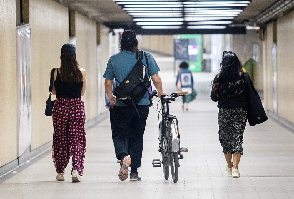 Montreal officials say they're temporarily boosting security patrols and cracking down on loitering in the city's metro system in order to increase transit users' sense of security. A man wheels his bicycle through a metro station in Montreal, April 16, 2023. THE CANADIAN PRESS/Graham Hughes