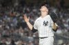 FILE - New York Yankees pitcher Clarke Schmidt reacts as he leaves the field after being removed from the game in the sixth inning of a baseball game against the Kansas City Royals, July 21, 2023, in New York. (AP Photo/Mary Altaffer, File)