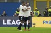 Germany's Leon Goretzka, right, celebrates after scoring his side's second goal during the soccer Nations League quarterfinal first leg soccer match between Italy and Germany, at the San Siro stadium in Milan, Italy, Thursday, March 20, 2025. (AP Photo/Luca Bruno)
