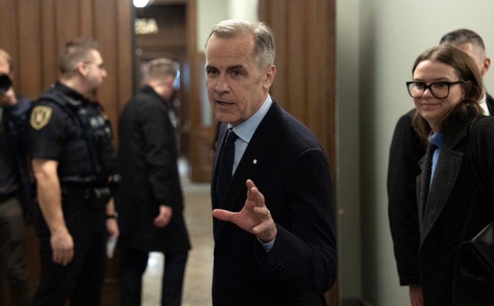 Liberal Leader Mark Carney speaks briefly with media before making his way to a caucus meeting in Ottawa, Monday, March 10, 2025. THE CANADIAN PRESS/Adrian Wyld