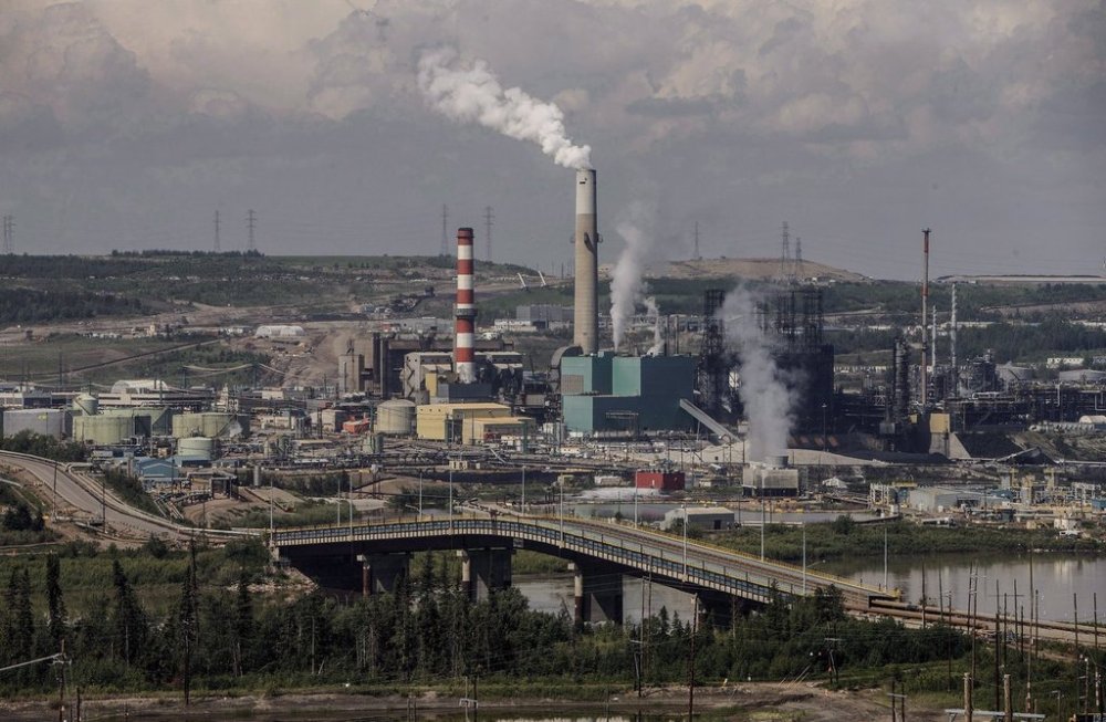 The Alberta government says Premier Danielle Smith has been in talks with a multinational oil and petrochemical player about selling two million barrels a month of province-owned heavy oil. Suncor Energy's base plant with upgraders in the oilsands in Fort McMurray Alta., on Monday June 13, 2017. THE CANADIAN PRESS/Jason Franson