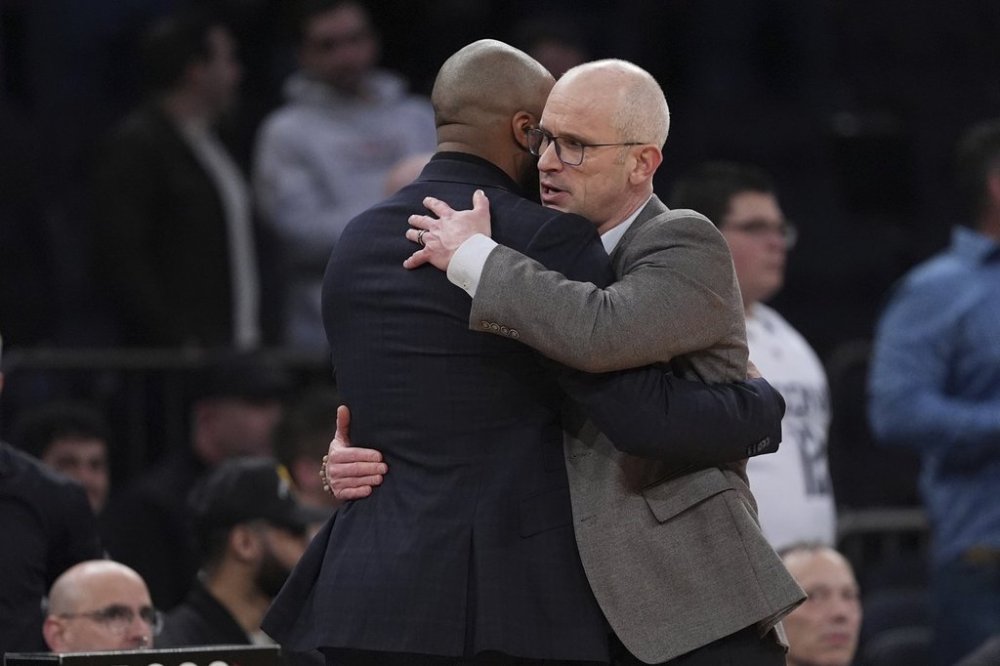 UConn head coach Dan Hurley, right, hugs Villanova head coach Kyle Neptune after an NCAA college basketball game at the Big East basketball tournament Thursday, March 13, 2025, in New York. (AP Photo/Frank Franklin II)