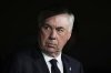 Real Madrid's head coach Carlo Ancelotti sits before the Spanish Copa del Rey semifinal second leg soccer match between Real Madrid and and Real Sociedad in Madrid, Spain Tuesday, April 1, 2025. (AP Photo/Bernat Armangue)