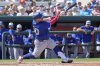 Toronto Blue Jays' Alejandro Kirk hits an RBI single in the fourth inning of a spring training baseball game, Monday, March 3, 2025, in Lakeland, Fla. (AP Photo/John Raoux)