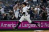 New York Yankees' Ben Rice runs to home plate after Aaron Judge homered on a fly ball to right center field during the first inning of a baseball game against the Arizona Diamondbacks, Thursday, April 3, 2025, in New York. (AP Photo/Julia Demaree Nikhinson)