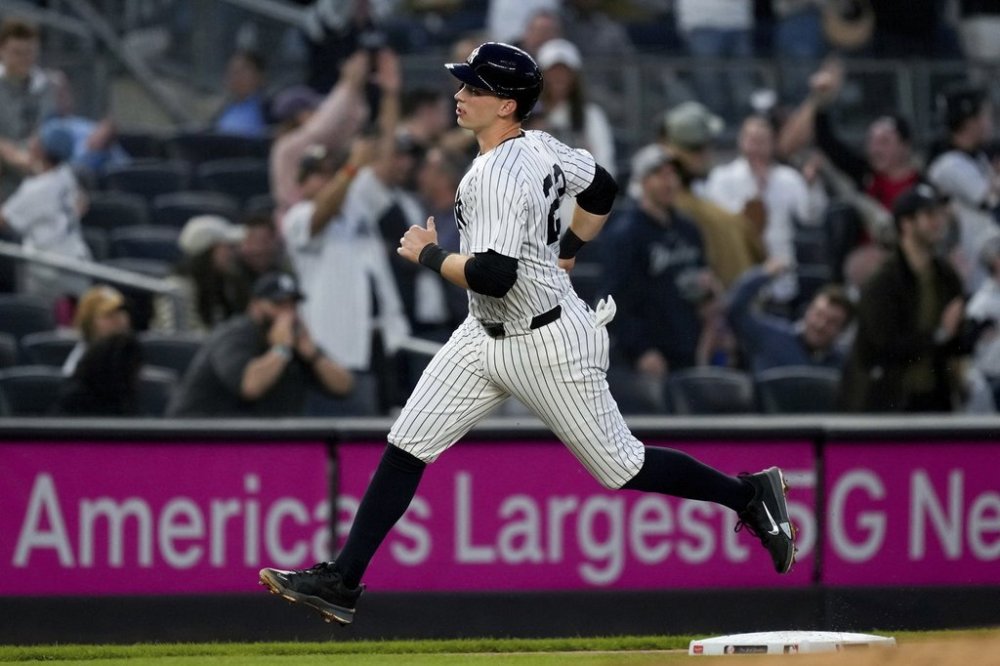 New York Yankees' Ben Rice runs to home plate after Aaron Judge homered on a fly ball to right center field during the first inning of a baseball game against the Arizona Diamondbacks, Thursday, April 3, 2025, in New York. (AP Photo/Julia Demaree Nikhinson)