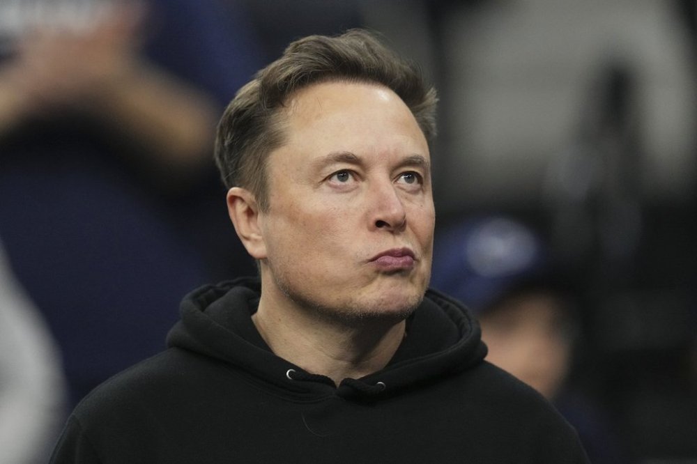 Elon Musk attends the finals at the NCAA wrestling championship, Saturday, March 22, 2025, in Philadelphia. (AP Photo/Matt Rourke)