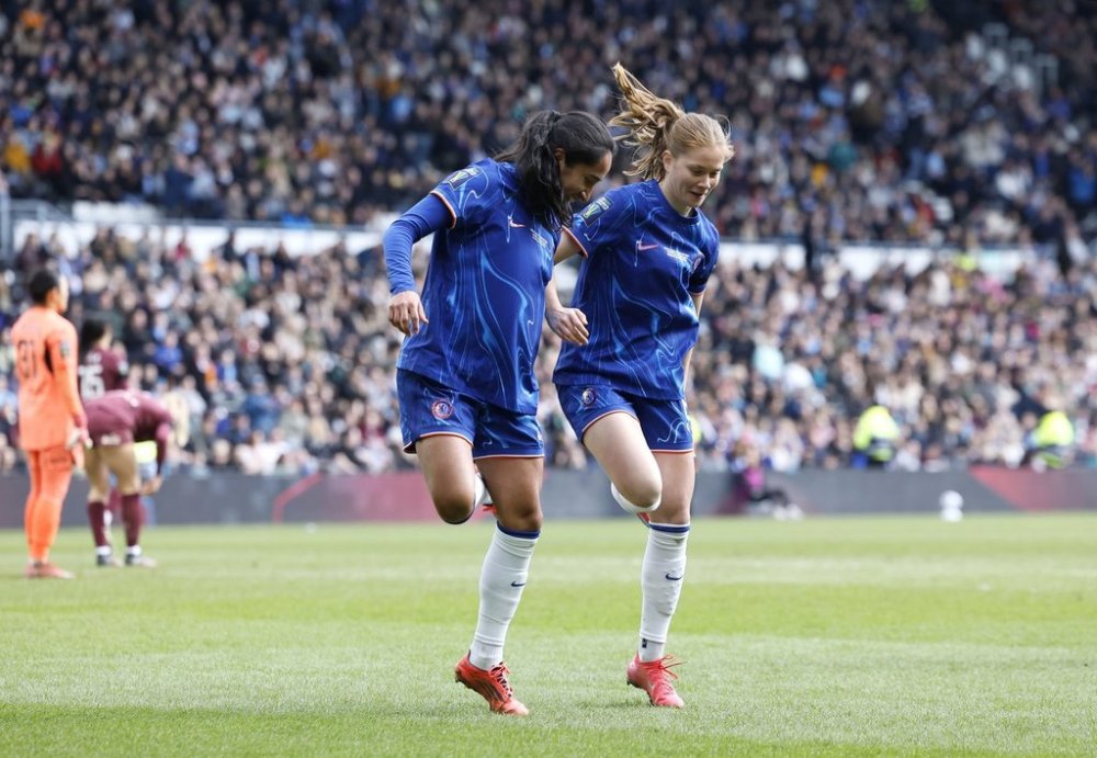 Chelsea's Mayra Ramirez (left) celebrates scoring their side's first goal of the game with team-mate Sjoeke Nusken, during the English women's League Cup soccer final match between Chelsea and Manchester City, at Pride Park Stadium, Derby, England, Saturday March 15, 2025. (Richard Sellers/PA via AP)