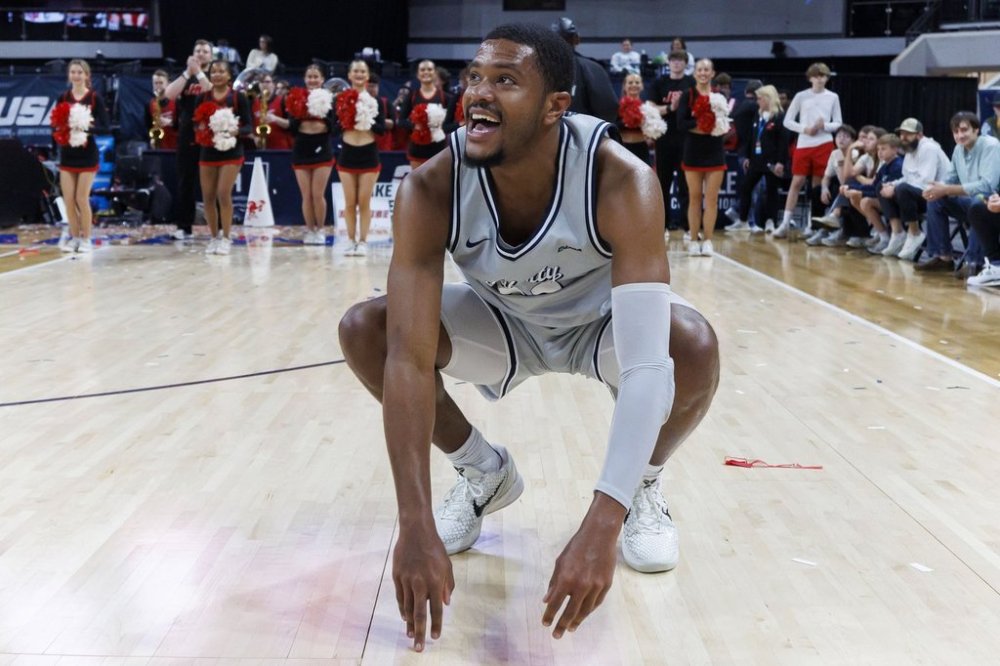 Liberty guard Jayvon Maughmer celebrates after a win in an NCAA college basketball game against Jacksonville State in the championship of the Conference USA tournament, Saturday, March 15, 2025, in Huntsville, Ala. (AP Photo/Vasha Hunt)
