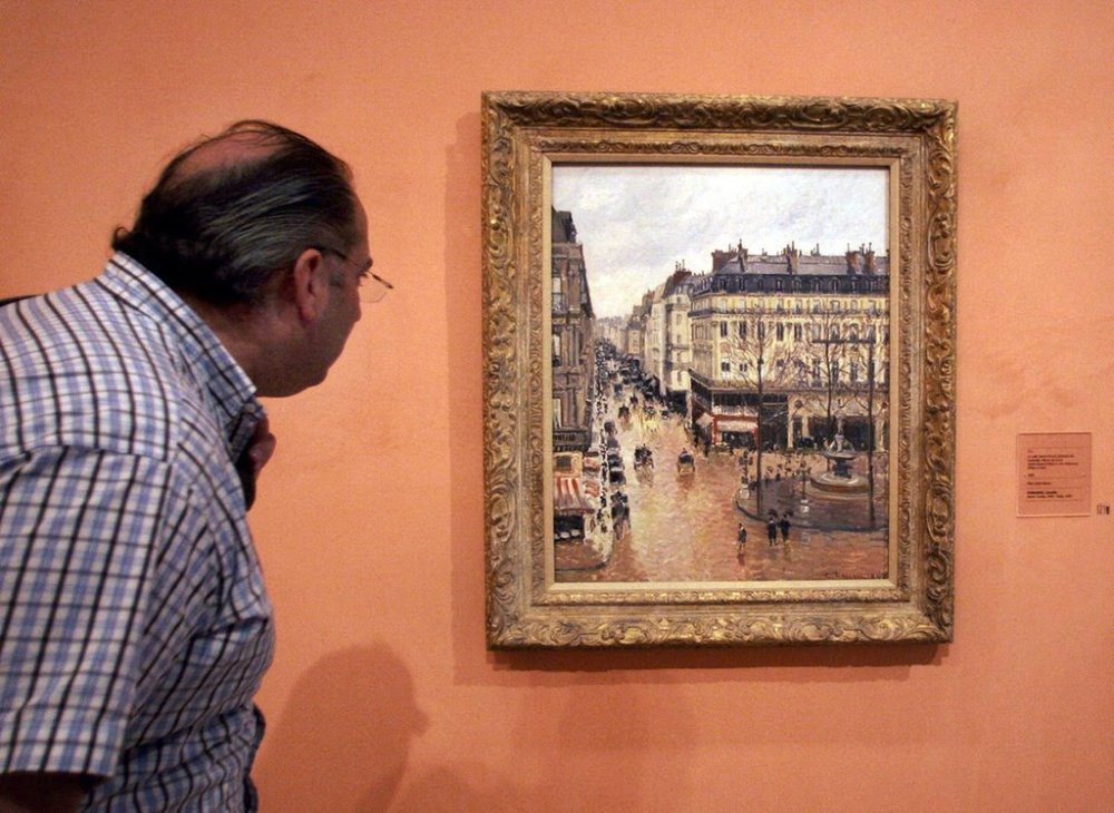 FILE - A visitor views the Impressionist painting called